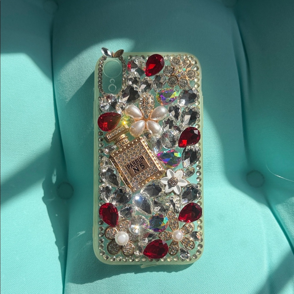 Glamorous Crystal Phone Case with Red and Gold Accents